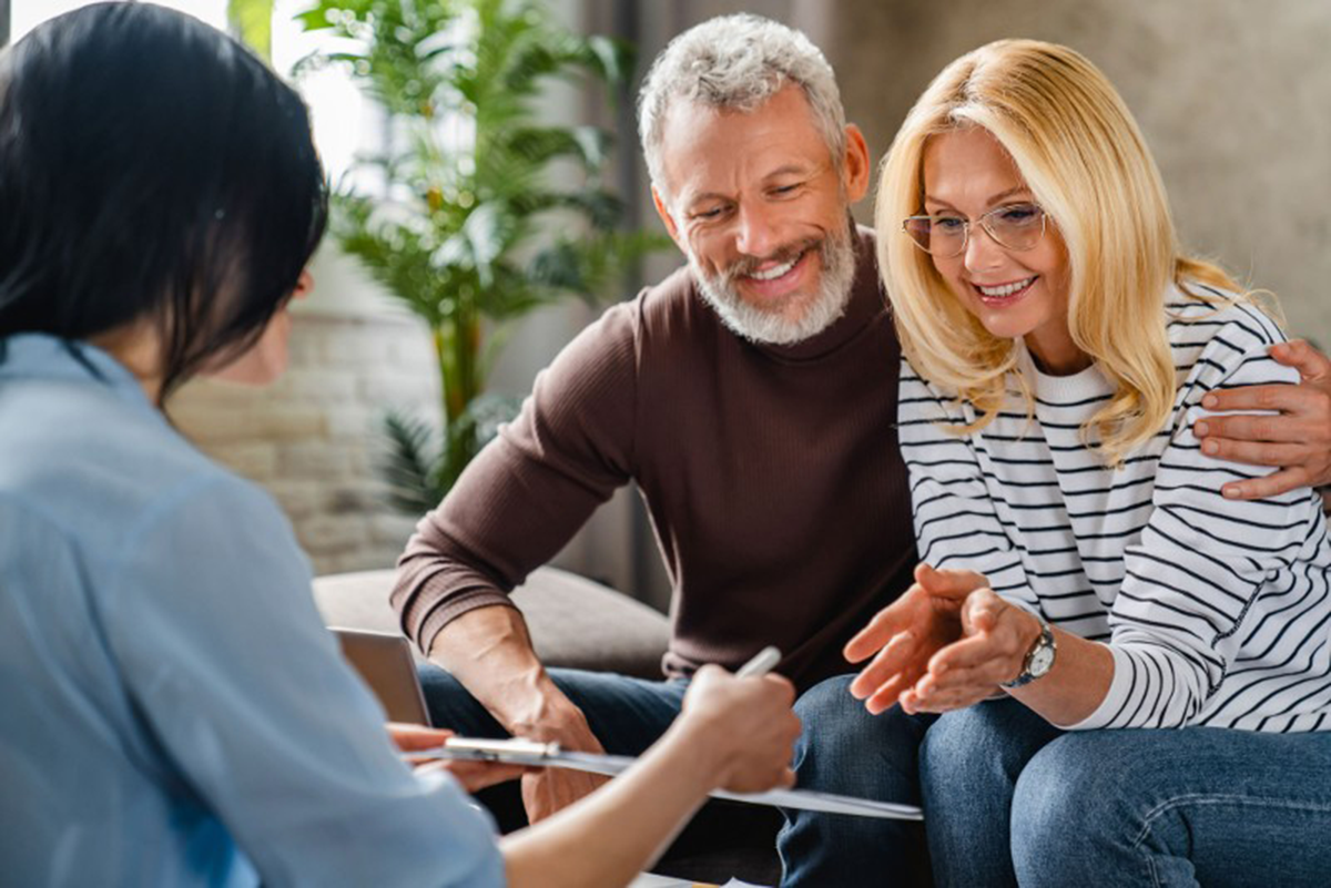 A Davidson Law Group counselor reviewing an estate plan with a couple