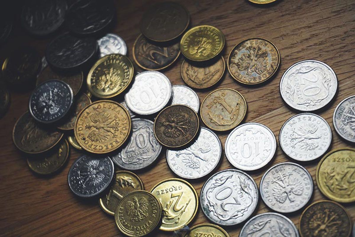 Coins arranged on a table representing accumulated wealth