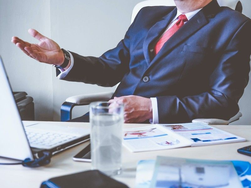 A business advisor discussing succession planning at a desk